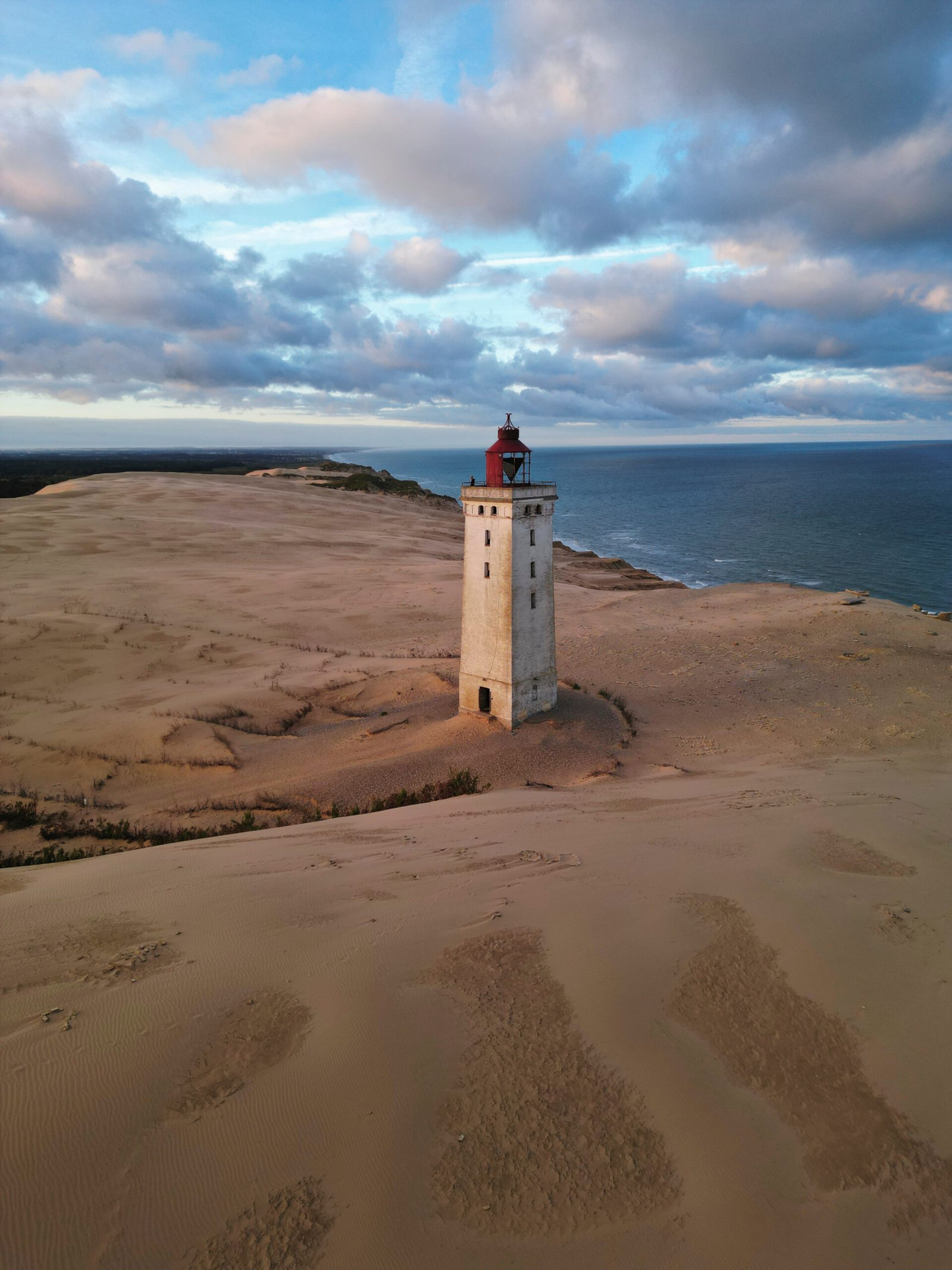 Rubjerg knude lighthouse on the west coast of denmark during a beautiful sunset sunrise golden hour